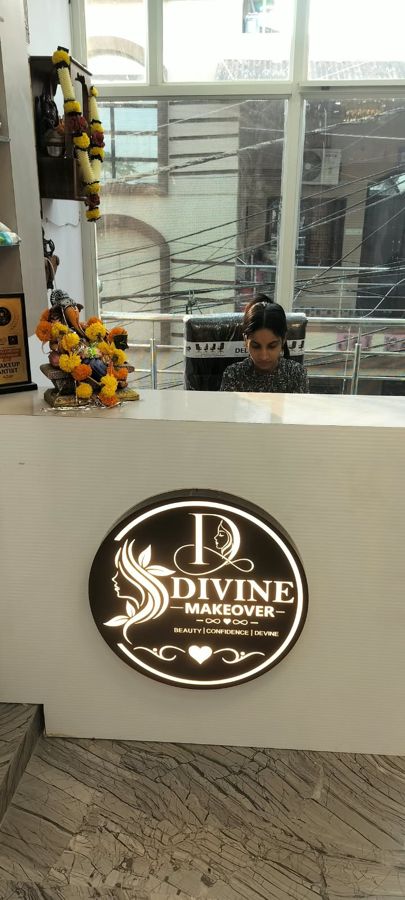 Reception desk with the Divine MakeOver logo - Divine MakeOver, Mandla